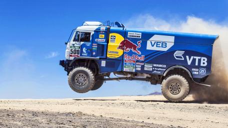 Mighty Truck Leaps Through Desert Dusty Trails wallpaper
