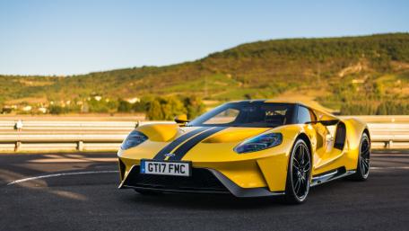 Sleek Yellow Sports Car on Track wallpaper