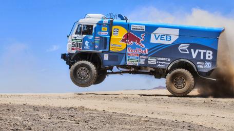 Thrilling Off-Road Truck Jumping Action wallpaper