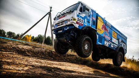Powerful Truck Soars Over Rough Terrain in 4K Wallpaper wallpaper