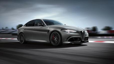 Sleek Alfa Romeo Racing Amongst Shadows wallpaper
