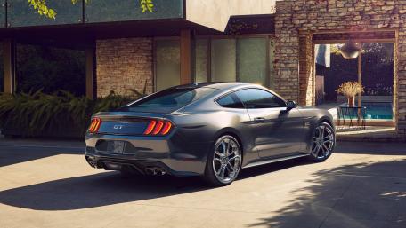 Sleek Mustang GT in a Modern Setting wallpaper