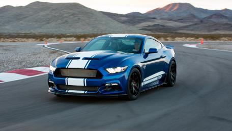 Sleek Blue Mustang on the Race Track wallpaper