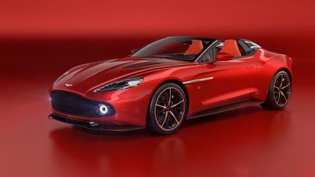 Sleek Aston Martin on Bold Red Background wallpaper