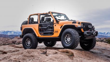 Adventure Awaits with This Bright Orange Jeep Wrangler wallpaper