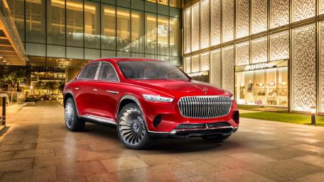 Sleek Red Luxury SUV Design in Urban Setting wallpaper