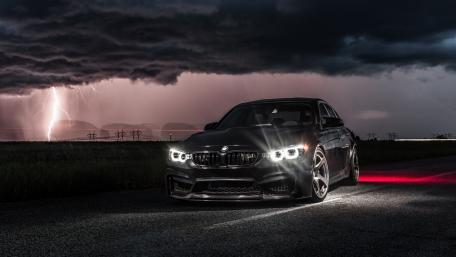 Stormy Night with a Powerful BMW Car Wallpaper wallpaper