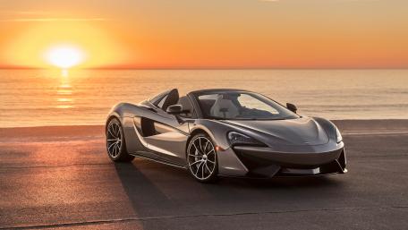 Sleek McLaren by the Ocean Sunset wallpaper