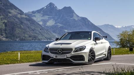 Sleek Mercedes in Scenic Mountain Landscape wallpaper