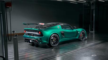 Sleek Green Sports Car in a Modern Garage wallpaper