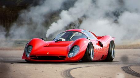 Sleek Red Sports Car in Action wallpaper