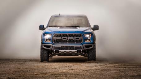 Powerful Blue Ford Truck in Desert Dust wallpaper