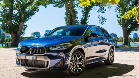 Sleek BMW X2 in Vibrant Outdoor Setting wallpaper