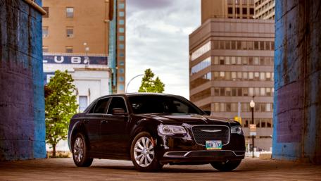 Sleek Black Chrysler in Urban Setting wallpaper