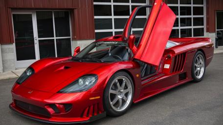 Sleek Red Supercar with Iconic Doors wallpaper