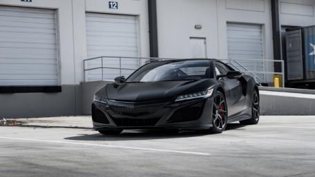 Sleek and Powerful Black Sports Car Wallpaper wallpaper