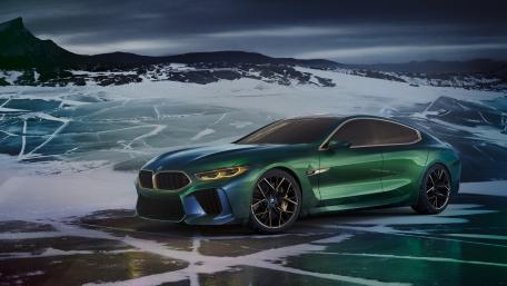 Sleek Green Sports Car on Icy Terrain wallpaper