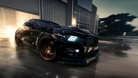 Sleek Black Muscle Car in Urban Setting wallpaper