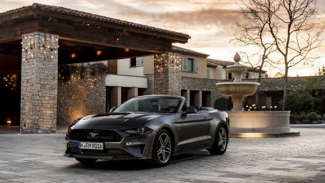 Sleek Convertible Car in Elegant Setting wallpaper