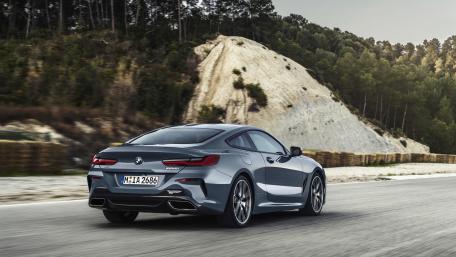 Sleek BMW Coupe on Open Road wallpaper