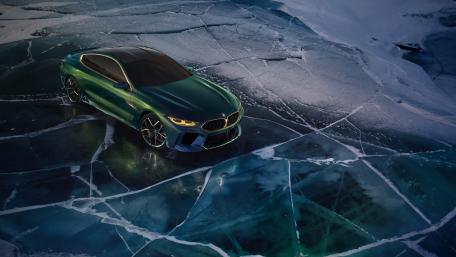Dynamic BMW on Icy Surface for Automotive Enthusiasts wallpaper