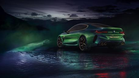 Sleek Green BMW in a Mystical Landscape wallpaper