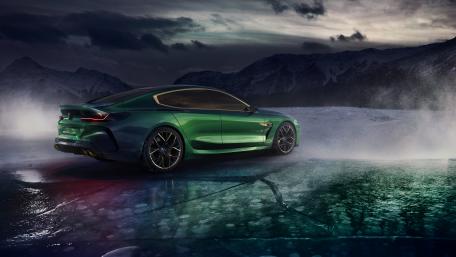 Dynamic Green Sports Car on Icy Landscape wallpaper