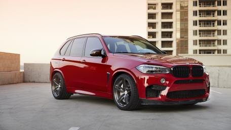 Stunning Red SUV in Urban Setting wallpaper