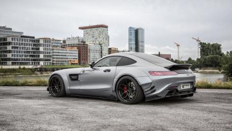 Sleek Luxury Sports Car in Urban Setting wallpaper