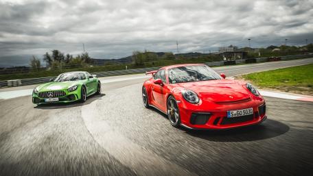 High-Octane Duel on the Track wallpaper