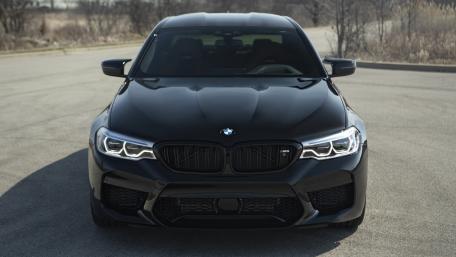 Sleek Black BMW M5 Captured in Motion wallpaper
