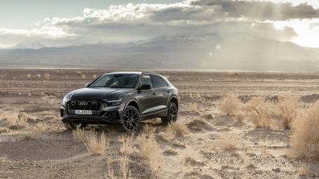 Sleek Audi Q8 in Rugged Landscape wallpaper