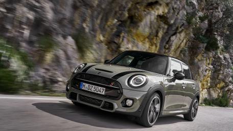 Sleek Mini Cooper on a Scenic Roadway wallpaper
