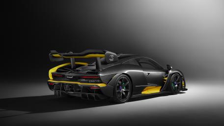 Sleek Black and Yellow Race Car Design wallpaper
