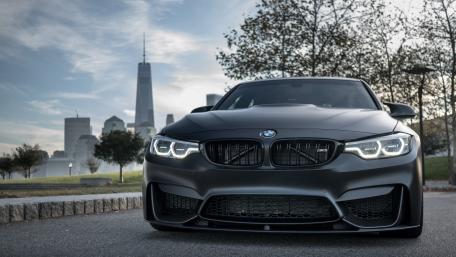 Sleek BMW in Urban Setting wallpaper
