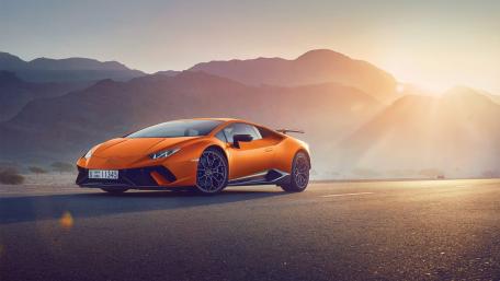 Vibrant Sunset Over Stunning Sports Car wallpaper