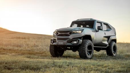 Powerful Rezvani Tank in Scenic Landscape wallpaper