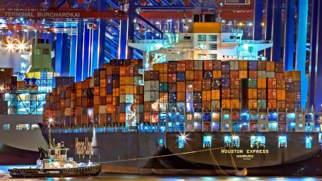 Vibrant Container Ship in Port at Night wallpaper