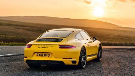 Sleek Yellow Porsche at Sunset Drive wallpaper