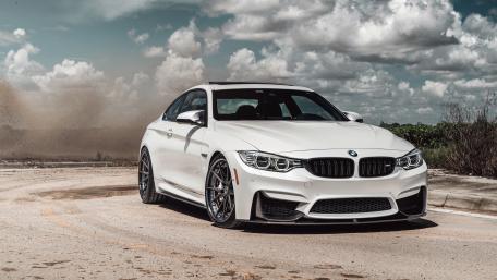 Sleek White BMW in Dynamic Setting wallpaper