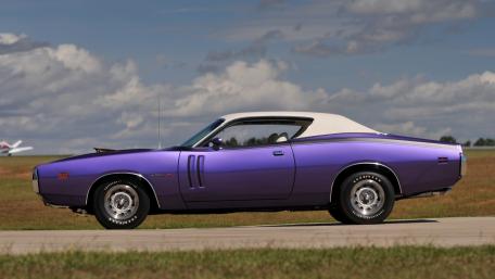 Classic Purple Muscle Car on Open Road wallpaper
