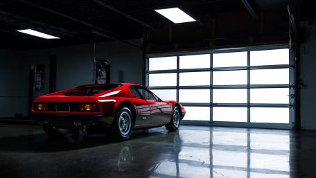 Classic Sports Car in an Industrial Setting wallpaper