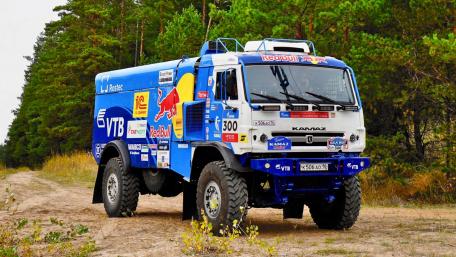 Powerful Kamaz Rally Truck in Action on Dirt Road wallpaper