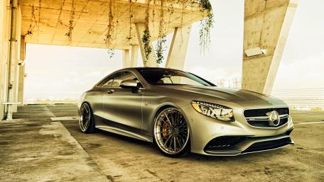 Sleek Silver Mercedes Coupe on Modern Concrete Structure wallpaper