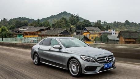 Sophisticated Mercedes Sedan on the Open Road wallpaper