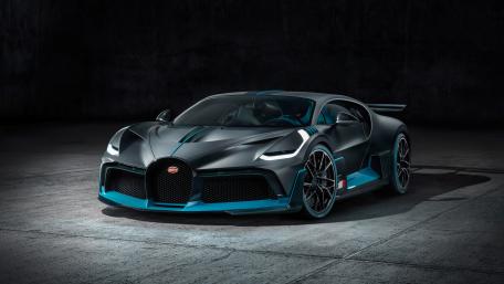 Sleek Bugatti Car in Dark Garage Scene wallpaper
