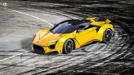 Sleek Yellow Supercar in Action wallpaper