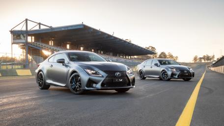 Sleek Performance Cars on the Track wallpaper