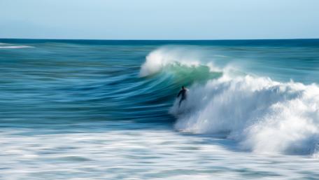 Surfer Riding a Majestic Wave wallpaper