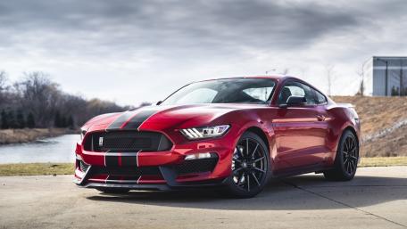 Sleek Red Sports Car on Display wallpaper